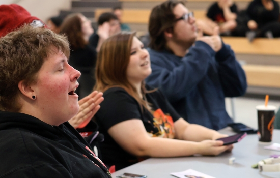 Students smile and laugh as they play Sexy Bingo