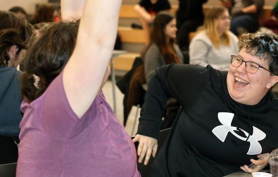 A student enthusiastically volunteers for Sexy Bingo