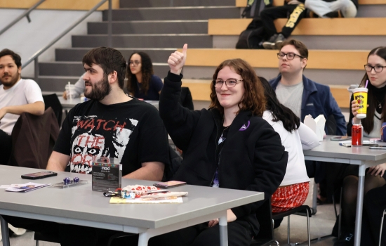 A student enthusiastically volunteers for Sexy Bingo
