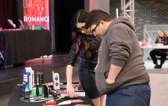Alisha helps a student select their prize