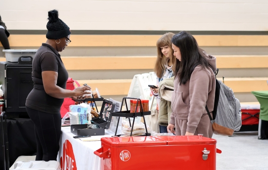 Students stop by the Zule Eats booth