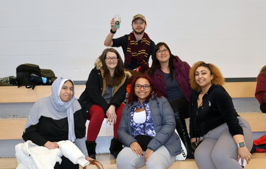 A smiling group of students enjoy the event