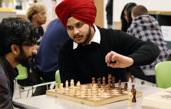 Two students play Chess