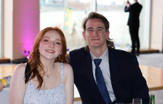 Two guests pose for the camera