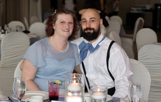 Two guests pose for the camera