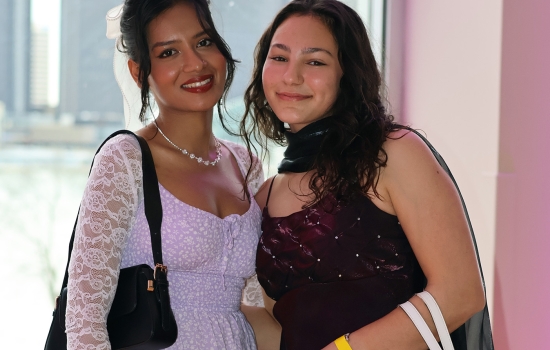 Two friends pose for the camera