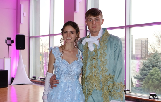 Two guests in regency attire pose for the camera