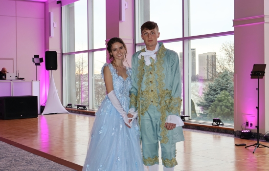 Two guests in regency attire pose for the camera