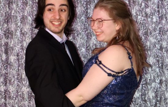 Two guests use the photobooth