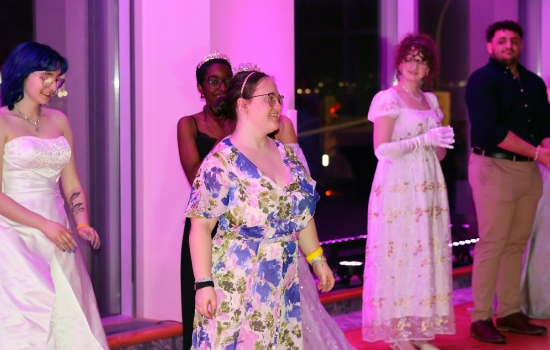 A guest shows off their dress