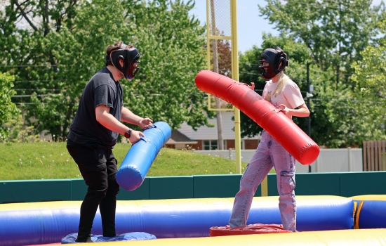 Two students face off in inflatable jousting