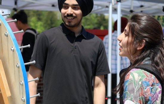 Pratham smiles and engages with students
