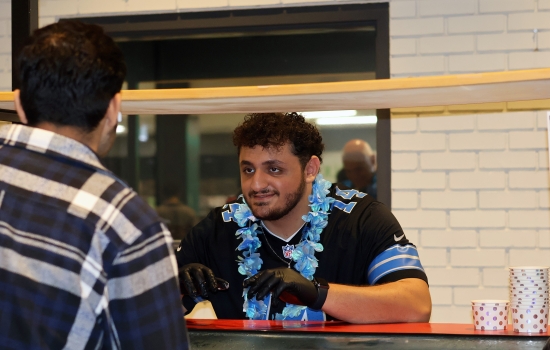 Ali serves a student ice cream