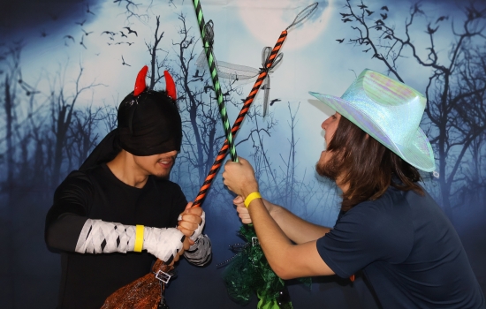 two fight with brooms