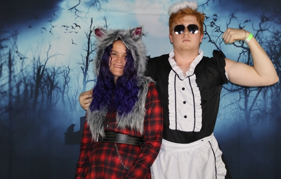 two in costume one flexing