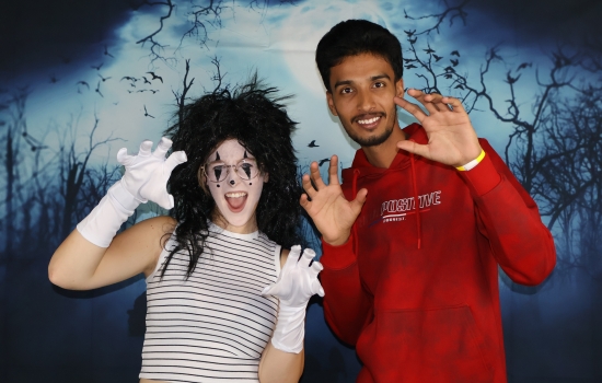 a mime and friend pose 