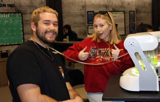 Two students enjoy the oxygen bar