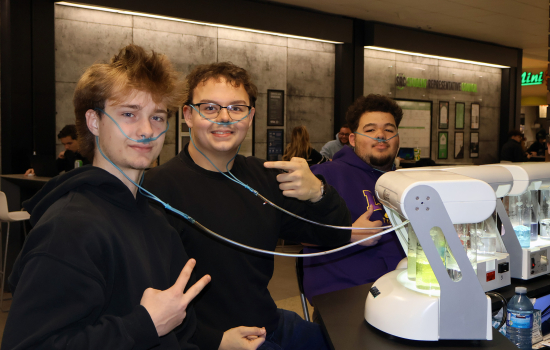 Three students enjoy the oxygen bar