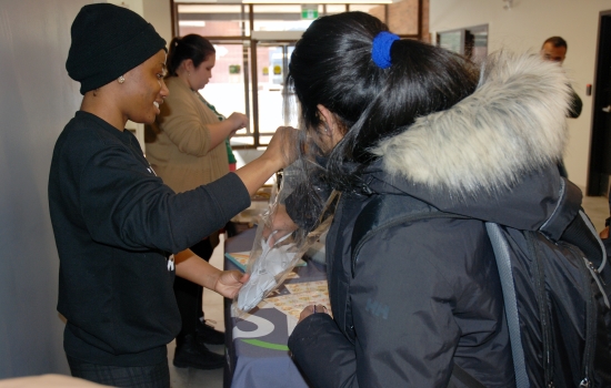 Students engage with Kenney at the booth