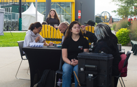students enjoy the free face painting and caricatures