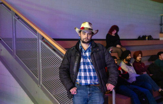 a student wears a cowboy hat