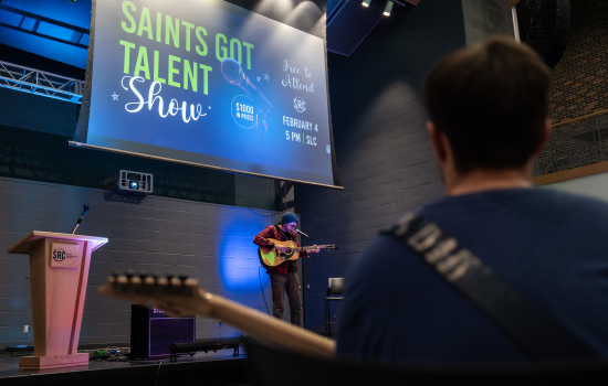 Saints Got Talent contestant performs with a guitar