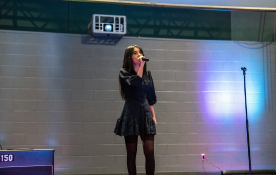 Contestant sings into the microphone