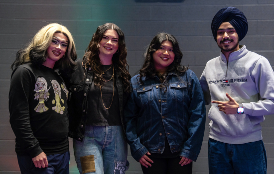 1st place winner poses with the judges