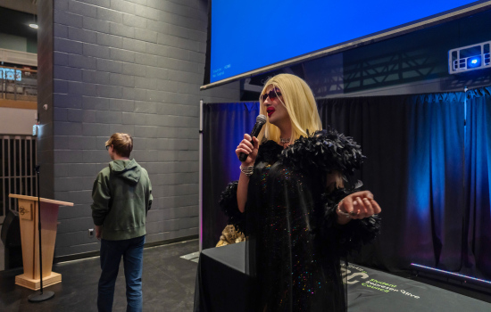 The host addresses the crowd