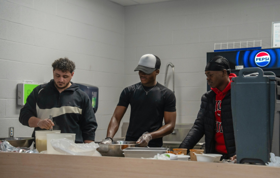 Ali, Somto and Micheal prep the food