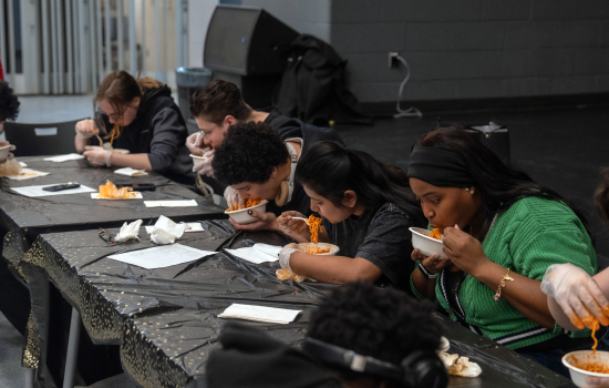 Contestants take on the spicy noodle challenge