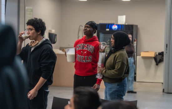 Micheal stands by with a jug of milk 