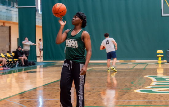 Micheal spins the ball on his finger in the classic gym