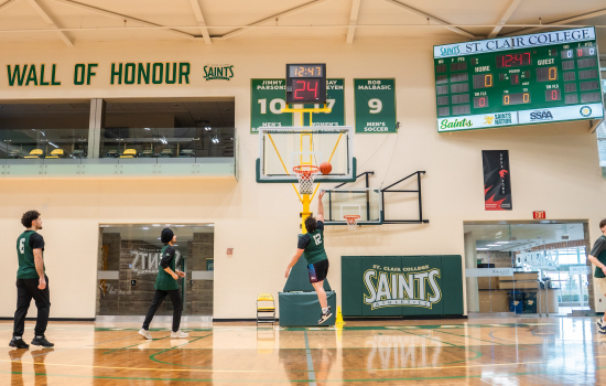 Ali jumps to make a practice basket