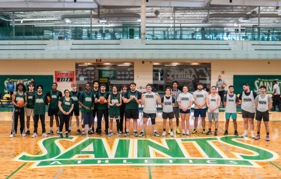 Group shot of all players in the classic gym