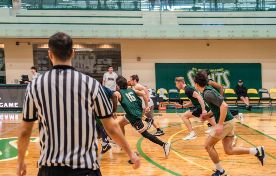 Basketball game in action with ref