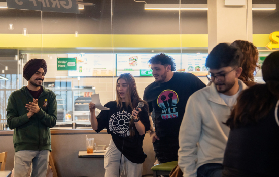 SRC Board members lead students in a music game