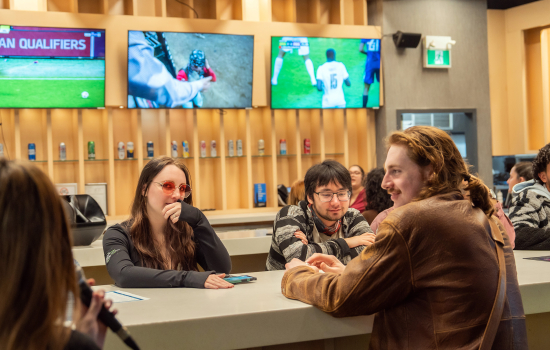 Students sit at the high top in Griff's