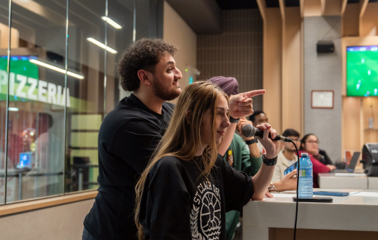 SRC Board members lead students in a music game