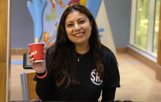 Brigitte poses with a Tim's cup