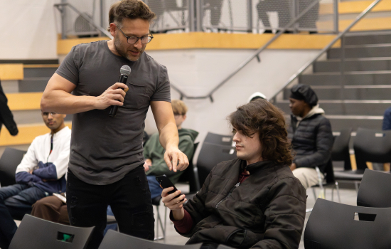 Eric Leclerc and a student volunteer in the audience