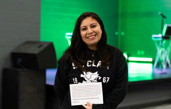 Brigitte smiles with her introduction script