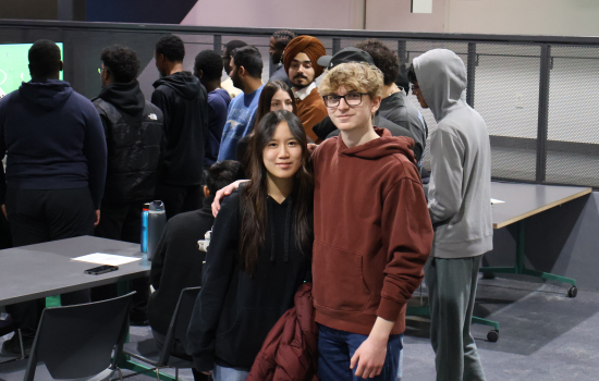 Two students pose for the camera in the Nexus