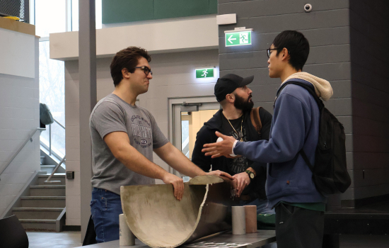 Club members speaks with a student