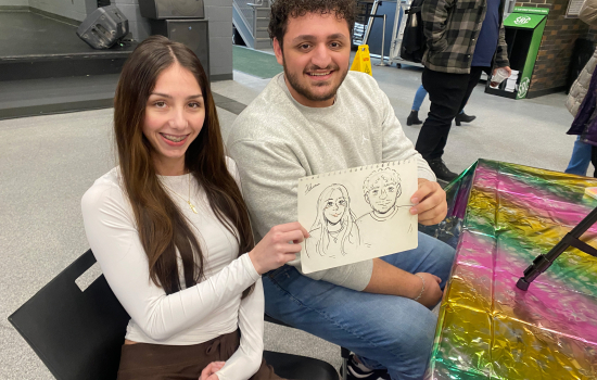 Julianna and Ali show off their caricature 