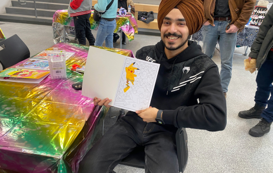 Pratham shows off his colouring page