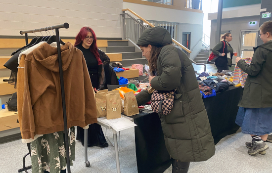 Students peruse the Fashion Club booth