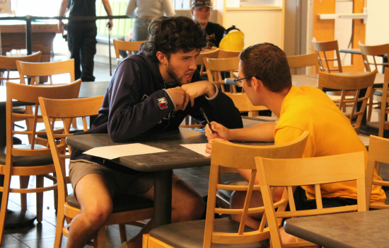 students discuss trivia answers
