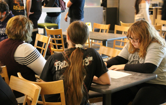 3 students enjoy trivia
