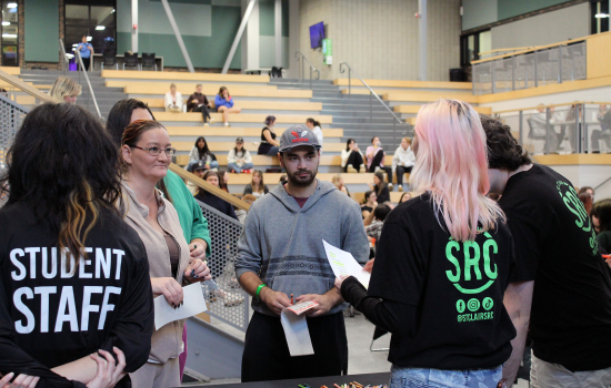 SRC board and staff members talk to students